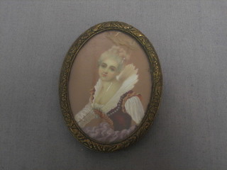 An oval portrait miniature of a lady, contained in a gilt frame 3"