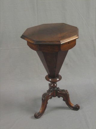 A Victorian octagonal rosewood work table of conical form with hinged lid raised on carved turned columns (slight warp top lid and veneers lifting) 17"