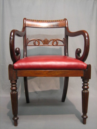 A 19th Century mahogany bar back desk chair with carved and pierced mid rail, raised on turned reeded supports