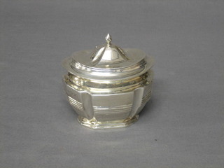 An Edwardian, Georgian style silver caddy of oval form with reeded body having a hinged lid, London 1900, 4 ozs