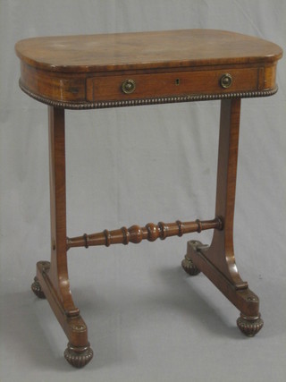 A William IV oval mahogany occasional table, fitted a drawer and raised on standard end supports with turned stretcher 24"