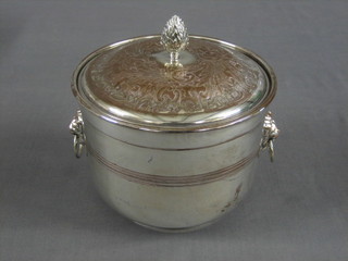A circular silver plated twin handled ice bucket