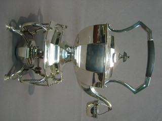 An octagonal silver plated tea kettle and stand by Kemp Brothers complete with burner 