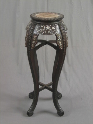 A 19th/20th Century circular Padouk wood jardiniere stand, inlaid mother of pearl and with pink veined marble top, raised on scrolled supports 12"