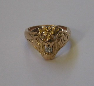 A gentleman's 18ct gold dress ring in the form of a lions mask set diamonds