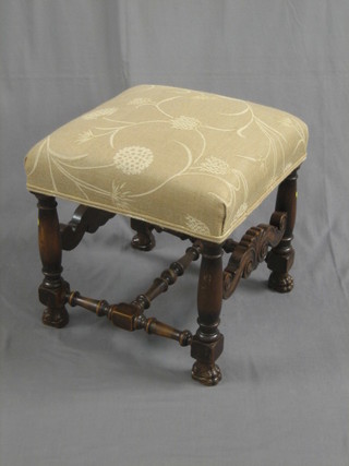 A 17th Century style walnut stool raised on turned and block supports 20"