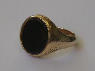 A gentleman's gold signet ring set an oval blood stone