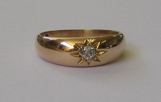 A gentleman's 18ct gold gypsy ring set a diamond