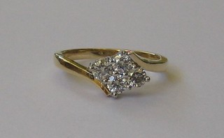 A lady's 18ct gold dress ring set 4 diamonds