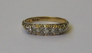 A lady's 18ct gold dress ring with 5 illusion set diamonds