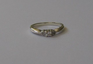 A lady's 9ct white gold dress ring set a diamond