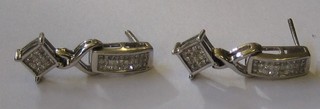 A pair of 18ct white gold diamond set earrings