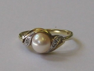 A lady's gold dress ring set demi-pearls and 2 small diamonds