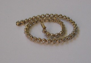 A 9ct gold bracelet set 50 diamonds