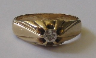 A gentleman's 9ct gold gypsy ring set a diamond