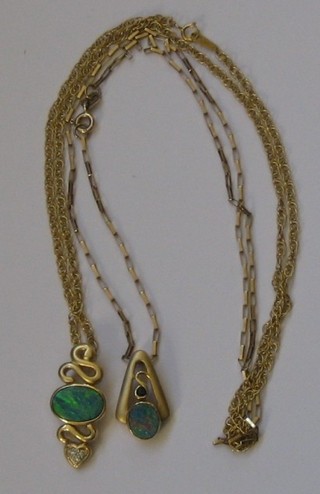 2 gold pendants set opals hung on fine gold chains