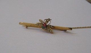A 9ct gold bar brooch in the form of an insect, set demi-pearls, garnets, green and blue stones