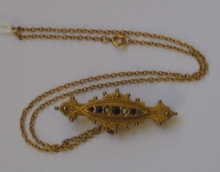 A Victorian 9ct gold pendant set sapphires and demi-pearls hung on a gold chain