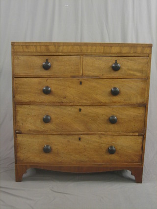 A Georgian mahogany chest of 2 short and 3 long drawers with tore handles and having crossbanded top and satinwood stringing, raised on bracket feet (scratches to the top) 