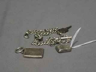 A  silver  curb link watch chain 13", a silver locket  and  a  silver match case in the form of an envelope