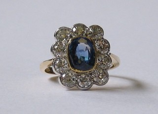 A  lady's  18ct  yellow gold dress ring set  an  oval  cut  sapphire surrounded by 10 diamonds approx 1.40/1.90ct