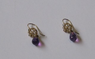 A pair of gold amethyst drop earrings surmounted by demi-pearls