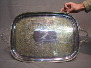 An oval engraved silver plated twin handled tea tray 26"