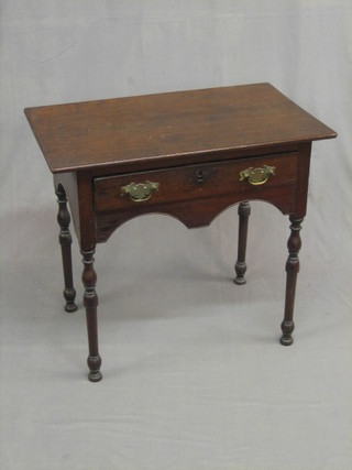 An  18th  Century oak low boy, fitted a drawer and  with  shaped apron, raised on turned supports 29"