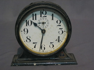 A Wurtemberg Nazi period alarm clock, the 4" painted dial  with Arabic numerals contained in a black painted case, the base  with later Royal Navy badge