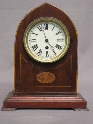 An  Edwardian  8  day  mantel  clock  with  enamelled  dial   and Roman  numerals contained in an inlaid mahogany lancet  shaped  case