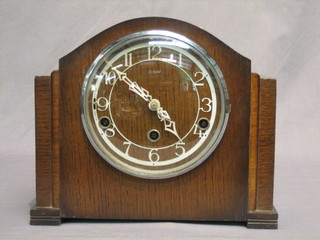 A  1930's chiming mantel clock by Enfield, contained in  an  oak case