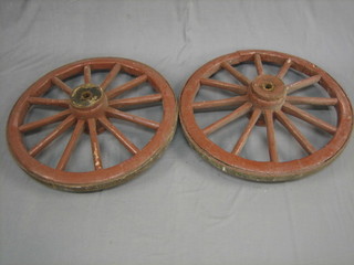 A pair of heavy spoked and iron clad wheels 29 1/2"