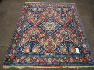 An Eastern carpet with central medallion 73" x 56"