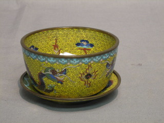 A  circular  yellow ground cloisonne bowl 4" raised on  a  saucer