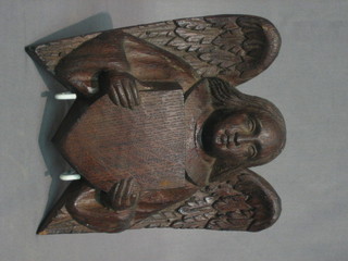 A  carved  oak  plaque  in the form of an  Angel  with  shield  6"