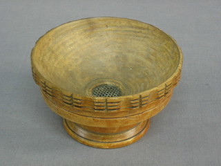 A circular turned wooden straining bowl 5"