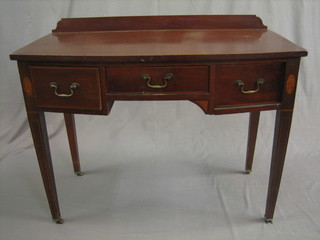 A  19th  Century  mahogany  inlaid  bow  front   writing/dressing table,  fitted 1 long drawer flanked by 2 short drawers, raised  on  square  tapering  supports  ending in brass caps  and  castors  41"