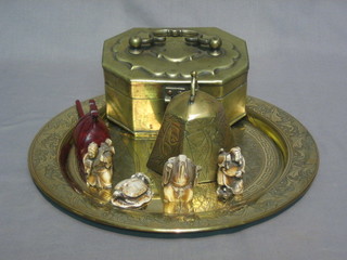 An  Eastern lozenge shaped metal trinket box with hinged lid  7", a  circular Eastern dish 13", a do. bell and  various  reproduction Netsukes