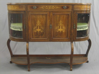 An  Edwardian  D  shaped  inlaid  rosewood  chiffonier  fitted   a drawer  above a double cupboard flanked by a pair  of  cupboards enclosed  by  glazed panelled doors, raised  on  cabriole  supports with undertier 52"