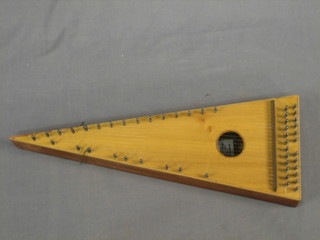 A 24 stringed triangular shaped Zither 21"