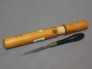 A  steel  bodkin with 3 1/2" blade and  ebony   handle,  complete with carrying case
