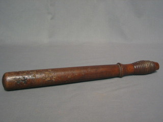 An Admiralty issue turned wooden truncheon marked ST CD 15" (reduced in length)