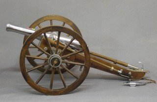A  20th Century model of an 18th Century canon  complete  with ram rods, the 14" barrel marked black powder only Cal 6.9 Spain Armas Gil 617