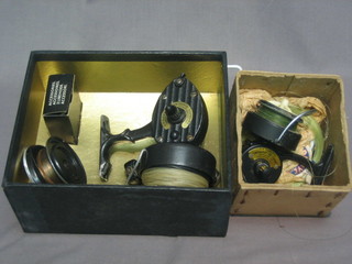 An Intrepid Supreme reel, boxed together with an Intrepid  Delux reel, boxed
