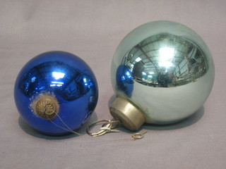 A green glass Witches ball 4" and a glue glass ditto 3"