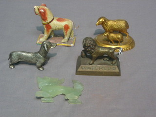 A   painted  wooden  figure  of  a  dog,  a  bronze  lion   marked Waterloo, a gilt metal figure of sheep and lamb, a metal figure of a dog and a "jade" figure of a dragon 