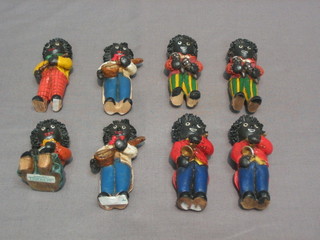 A 8 piece resin golliwog band marked 97Wui