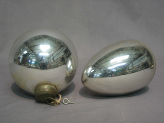 An  oval glass witches ball 6" and a cylindrical glass ditto 4  1/2"