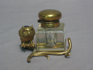 A  19th  Century square brass inkwell with hinged  lid  contained within  a  metal  frame decorated a seated owl, the  back  inset  a  hardstone