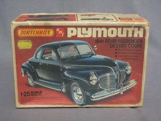 A Match box model car of a 1941 Plymouth Coupe